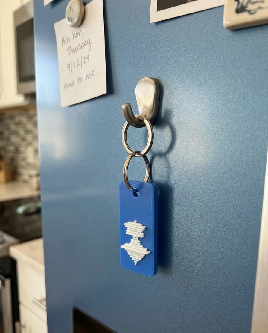 VoicePrint3D keychain on a fridge